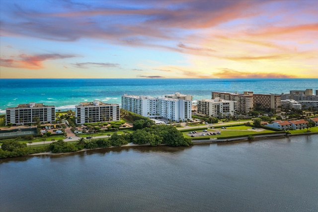 aerial view at dusk with a water view