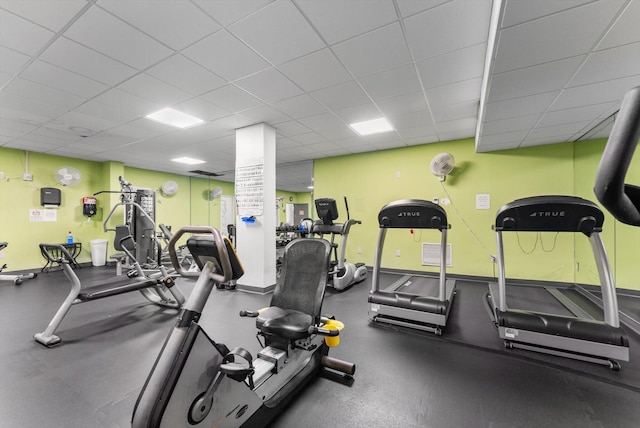 workout area featuring a drop ceiling