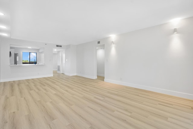 unfurnished living room with light hardwood / wood-style floors