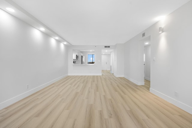 unfurnished living room featuring light hardwood / wood-style flooring