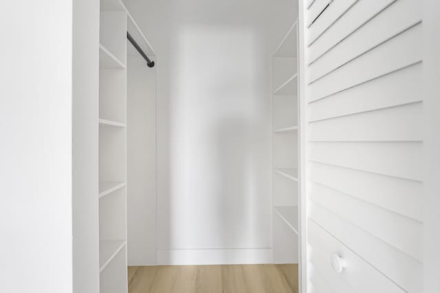 walk in closet featuring light wood-type flooring