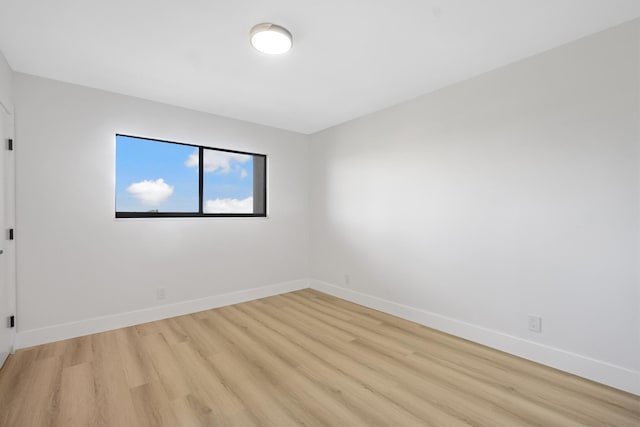 unfurnished room with light hardwood / wood-style floors