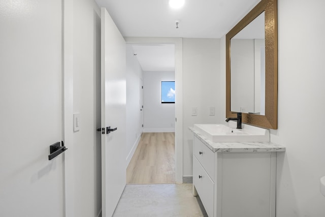 bathroom with wood-type flooring and vanity