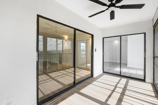 interior space with ceiling fan and light wood-type flooring