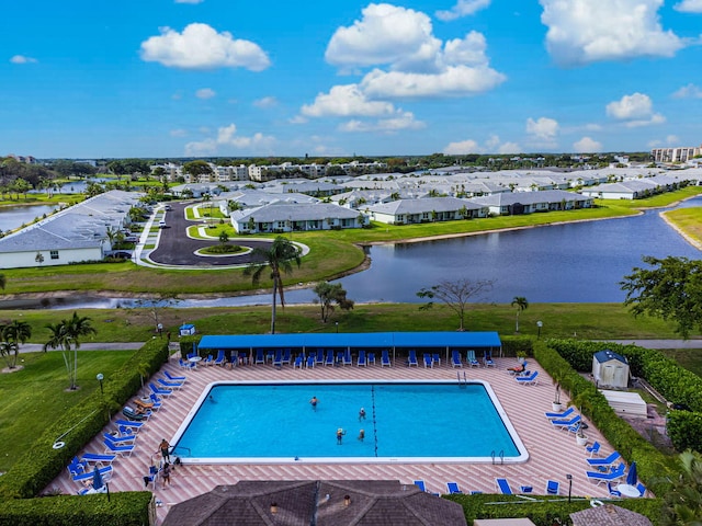 view of pool with a water view