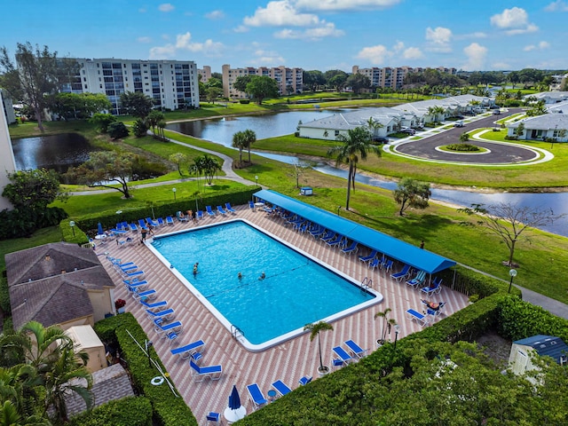 view of swimming pool with a water view