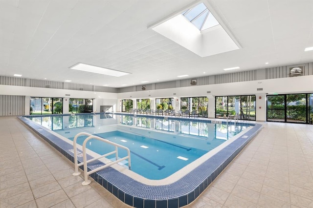 view of swimming pool featuring a skylight