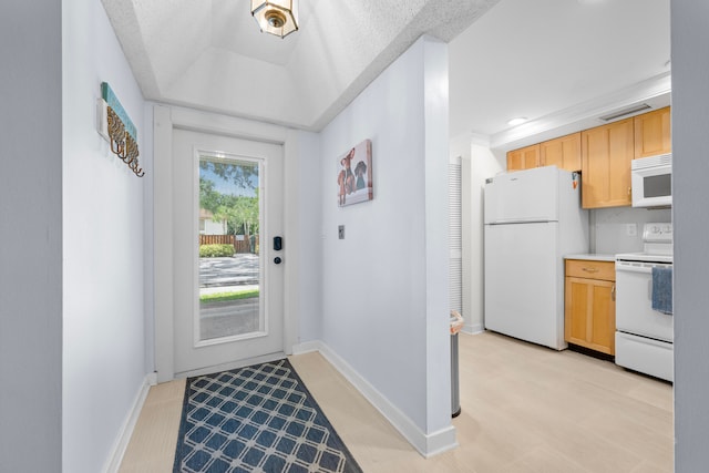 doorway with a textured ceiling