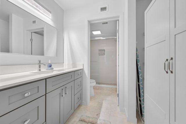 bathroom with vanity, curtained shower, and toilet