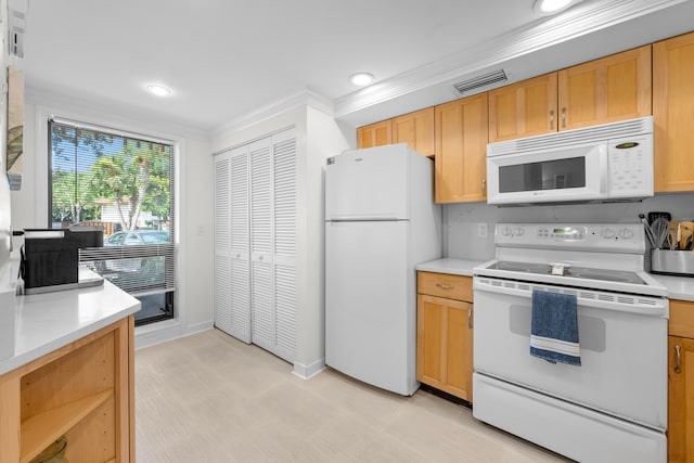 kitchen featuring white appliances, crown molding, and light brown cabinets