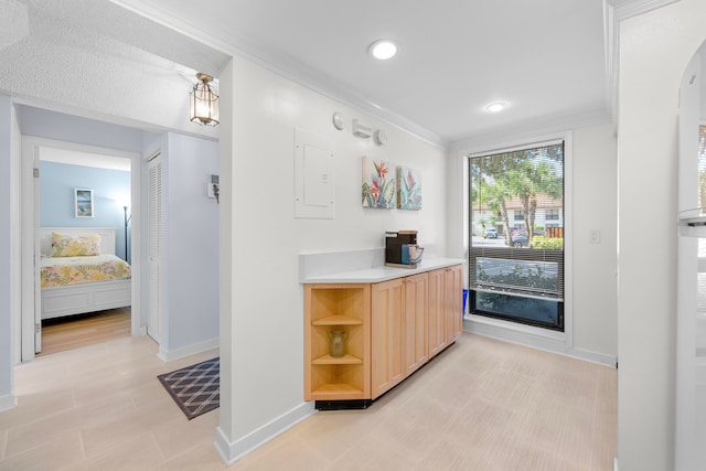 interior space with vanity and crown molding