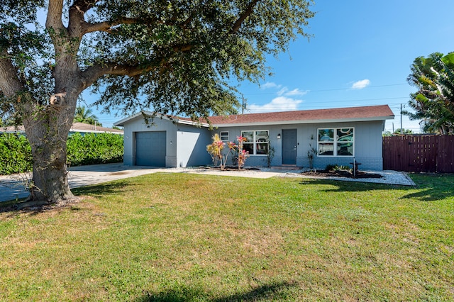 ranch-style house with a front lawn and a garage