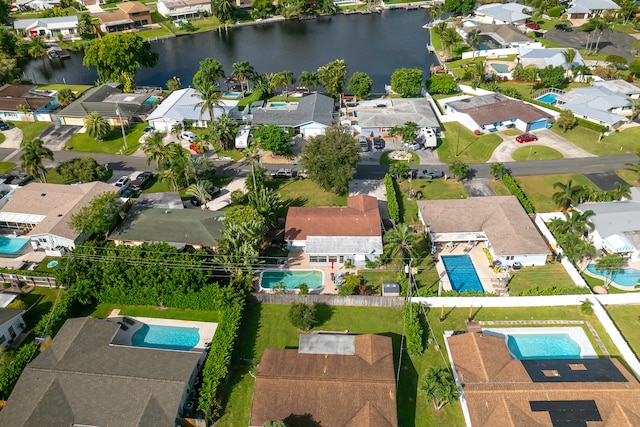 birds eye view of property with a water view