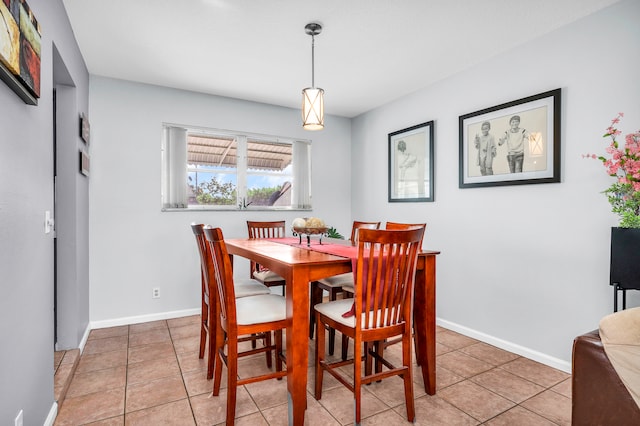 dining area with tile patterned flooring