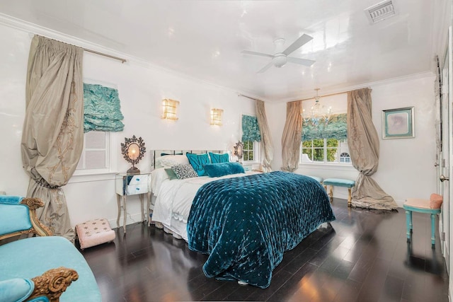 bedroom with ceiling fan with notable chandelier, dark hardwood / wood-style floors, and crown molding