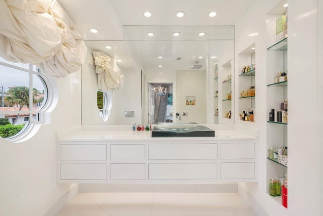 bathroom featuring tile patterned flooring, vanity, and built in features