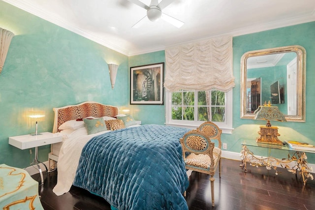 bedroom featuring hardwood / wood-style floors, ceiling fan, and crown molding