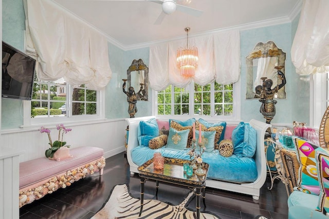 sitting room featuring ceiling fan with notable chandelier, dark hardwood / wood-style flooring, and ornamental molding