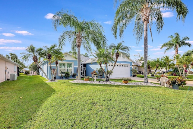 view of front of property featuring a garage, a front yard, and cooling unit