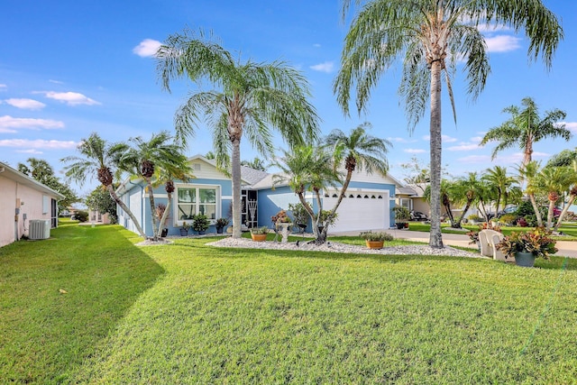 670 Senegal Ct, Fort Pierce, FL 34982 - view of front of house with central AC, a garage, a front yard, and driveway