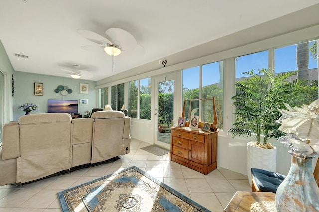 tiled living room with ceiling fan