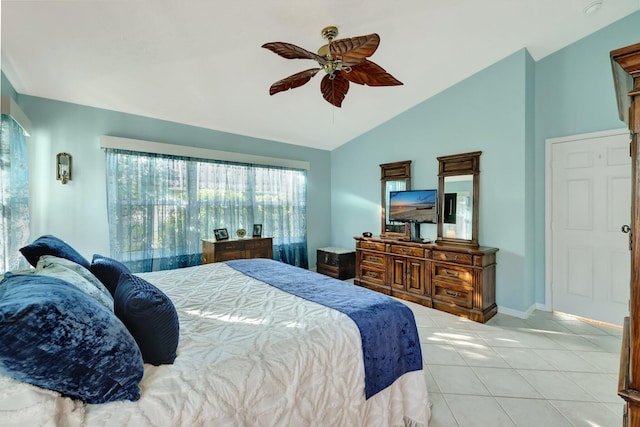 bedroom with ceiling fan, light tile patterned flooring, and lofted ceiling