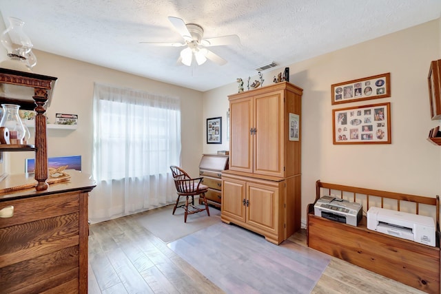 670 Senegal Ct, Fort Pierce, FL 34982 - office space featuring light wood-style flooring, a ceiling fan, and a textured ceiling
