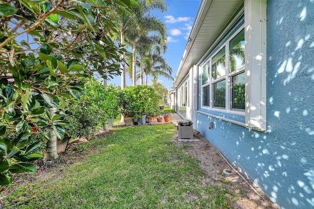 view of yard with central air condition unit