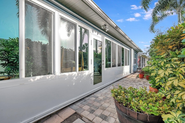 view of side of property featuring a patio