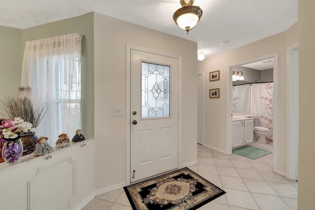 670 Senegal Ct, Fort Pierce, FL 34982 - foyer entrance featuring light tile patterned floors and baseboards