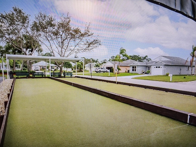 670 Senegal Ct, Fort Pierce, FL 34982 - view of community with a game area, a residential view, and driveway