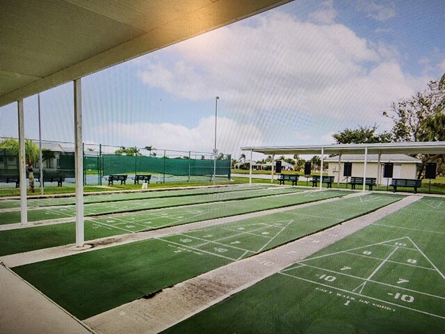 670 Senegal Ct, Fort Pierce, FL 34982 - surrounding community with fence and shuffleboard