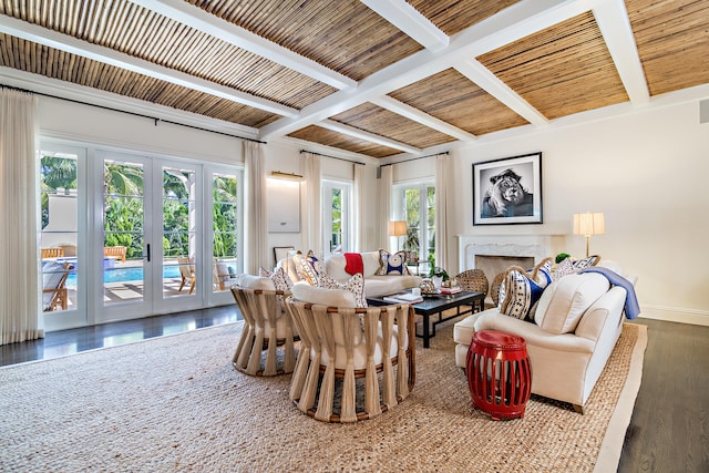 living room with french doors, a wealth of natural light, beamed ceiling, and dark hardwood / wood-style floors