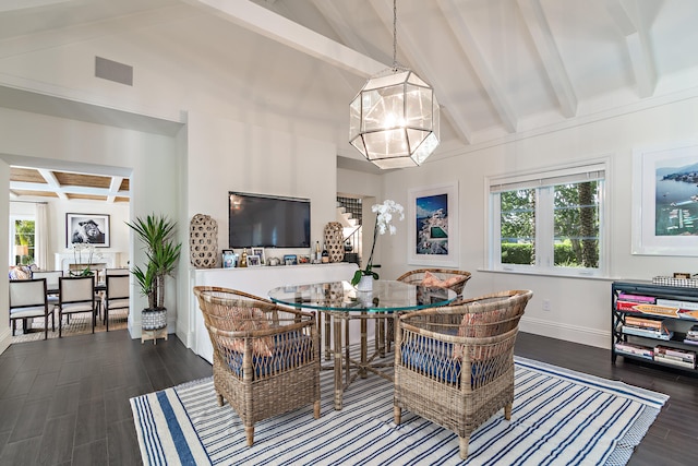 dining area featuring a healthy amount of sunlight, vaulted ceiling with beams, and dark hardwood / wood-style flooring