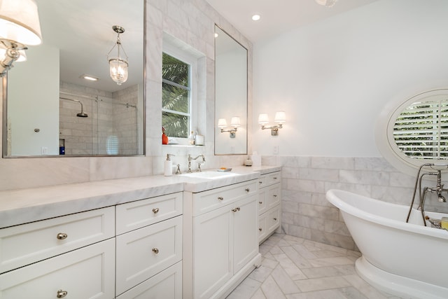 bathroom featuring vanity, plus walk in shower, and tile walls