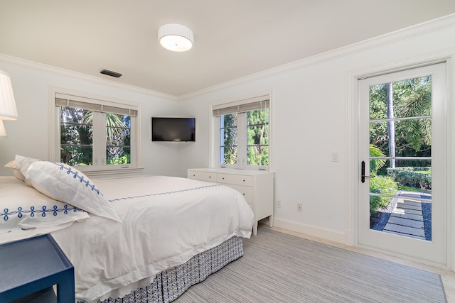 bedroom with access to exterior and ornamental molding