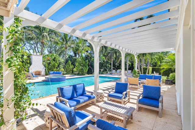 view of swimming pool featuring a patio, a pergola, pool water feature, and an outdoor hangout area