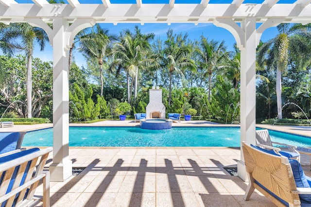 view of swimming pool with a patio area, a pergola, and pool water feature