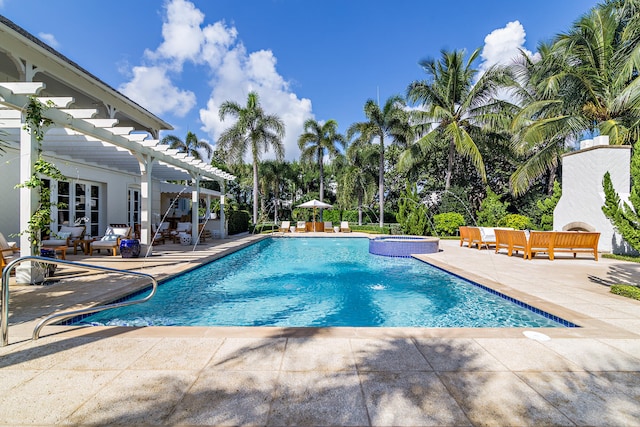 view of pool with a patio, outdoor lounge area, a pergola, and an in ground hot tub