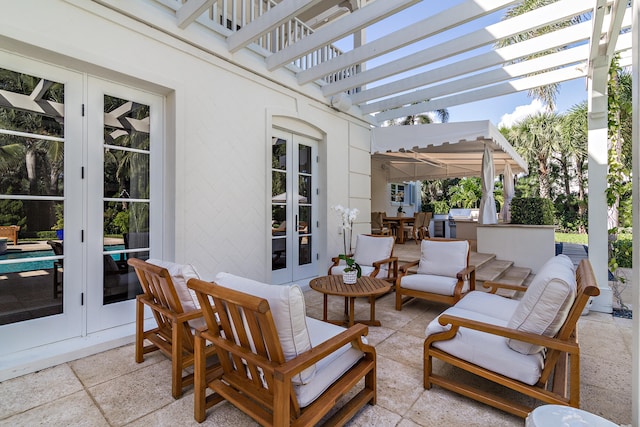 view of patio with french doors and a pergola