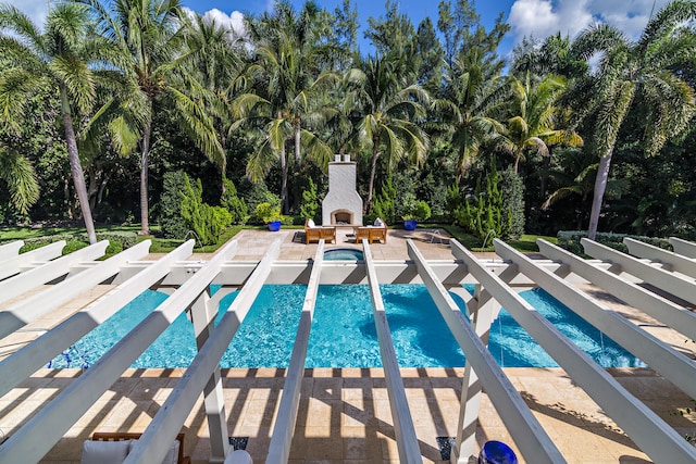 view of swimming pool with a patio area