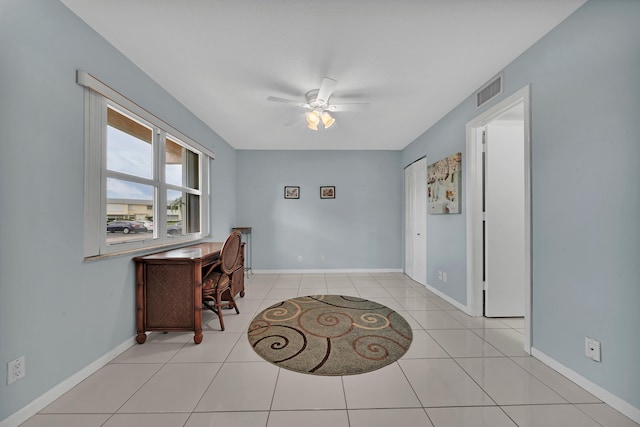 office with ceiling fan and light tile patterned flooring