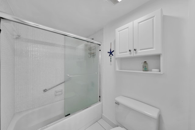 bathroom with enclosed tub / shower combo, tile patterned flooring, and toilet