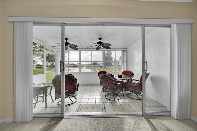 sunroom featuring ceiling fan