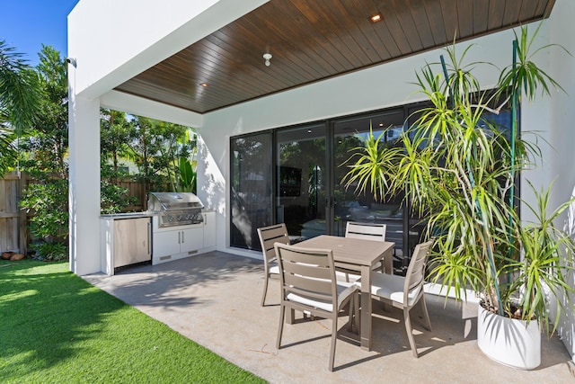 view of patio with area for grilling and grilling area