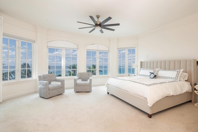 bedroom featuring ceiling fan, carpet, and ornamental molding