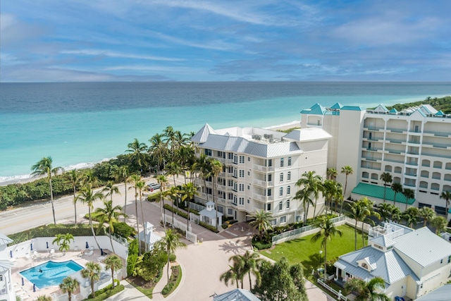 birds eye view of property featuring a view of the beach and a water view