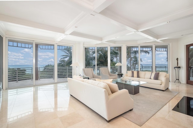 living room featuring beamed ceiling, a water view, and coffered ceiling