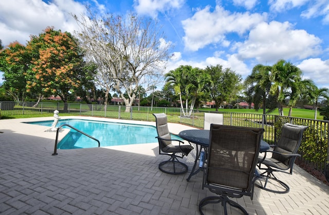 view of swimming pool with a patio area