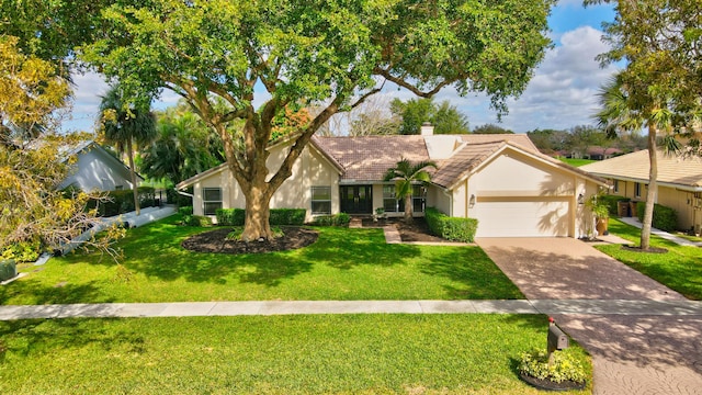 ranch-style house with a front lawn and a garage